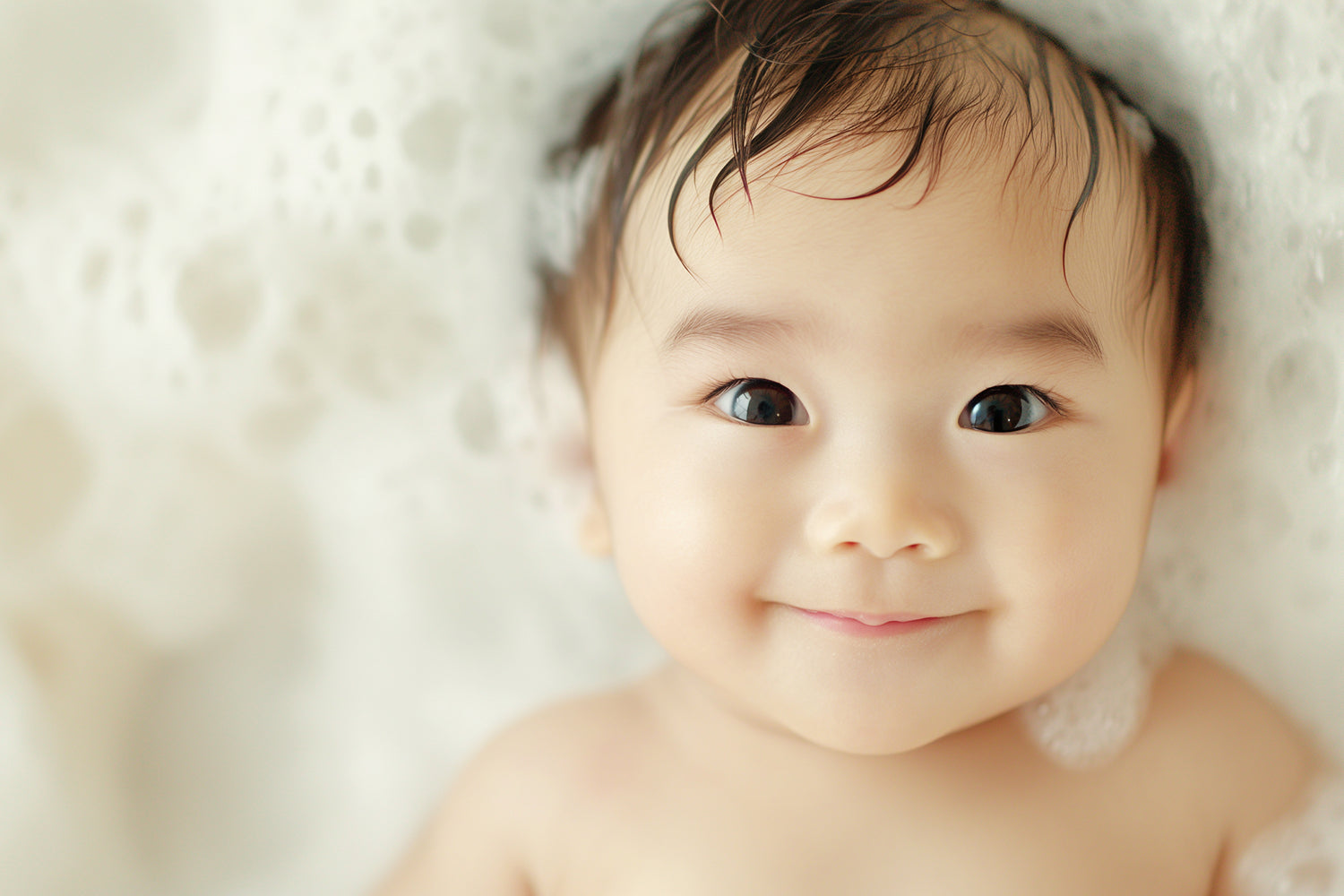 Baby Lying in Bubble Bath Staring Back at You